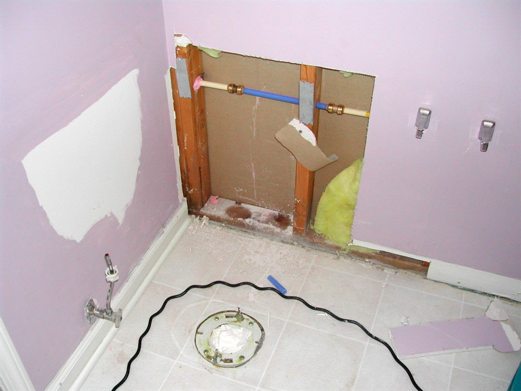 exposed pipes in bathroom